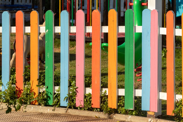 Beautiful bright colorful rack and pinion wooden fence, spring landscape.