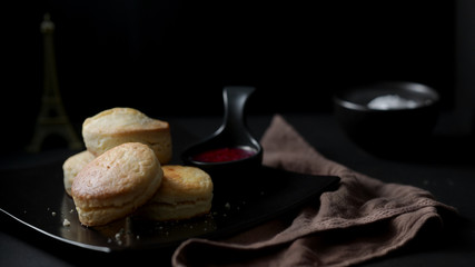 Close up view of Scones with strawberry jam and clotted cream