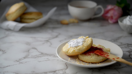 Close up view of British Scones with strawberry jam, clotted cream