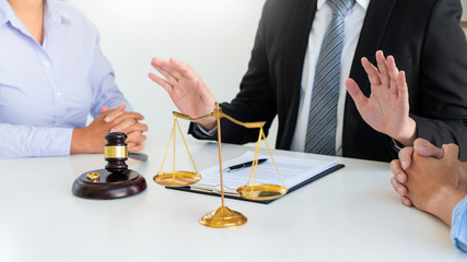 Judge gavel deciding on agreement prepared marriage divorce and Angry couple arguing telling their...