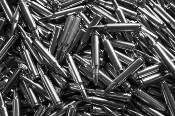 Black and white assault rifle bullet 5.56 for use background
