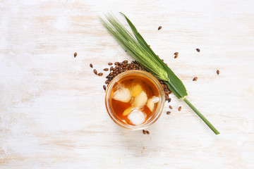 iced barley tea in a glass. caffeine free alternative healthy drink