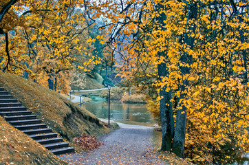 Fototapeta na wymiar Autumn in old public park, Europe