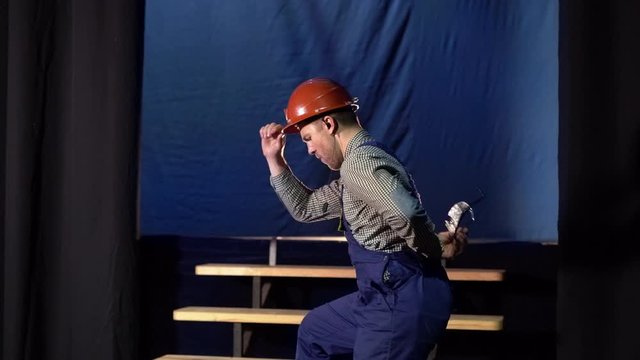 young installer rejoices and dances ascending the stairs