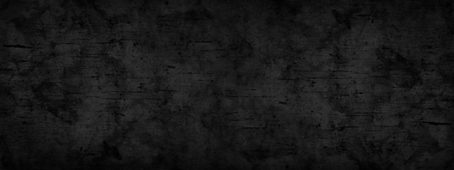 Abstract black background. Dark gray grunge background. Texture of a rough dirty surface. Black...