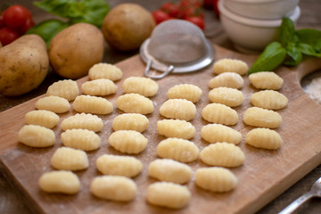 Uncooked fresh homemade gnocchi. Italian cuisine - raw gnocchi, made of potato and flour.