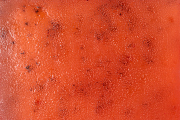 juicy appetizing marmalade made of red kiwi with pits close-up. sweet background