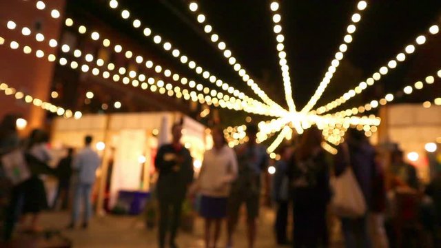 Timelaps of Night Market and people walking around with Blurred Light Bokeh effect