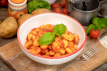 Gnocchi di patata, italian potato noodle with tomato sauce and basil, selective focus