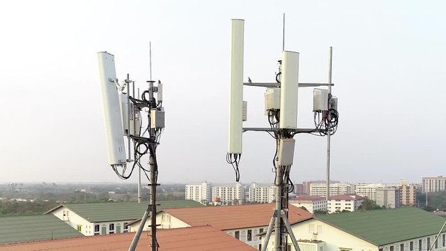 AERIAL CLOSE UP Modern Mobile Rooftop Telecommunication Transmitters