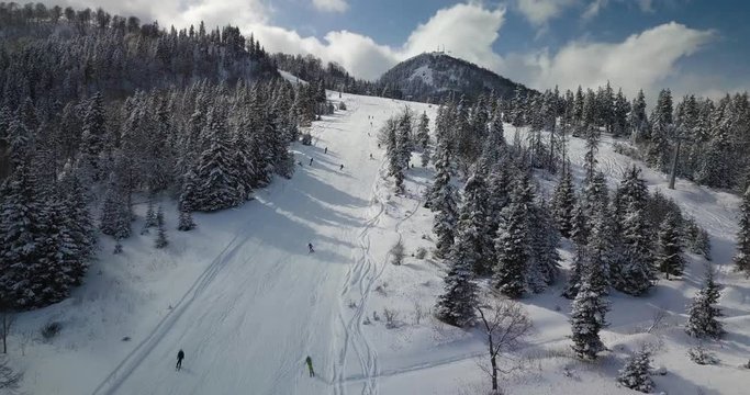 Beautiful aerial shot of skiers and ski lift in Bakuriani ski resort. 2023 years freestyle fis championship destination. Kokhta-Mitarbi Piste