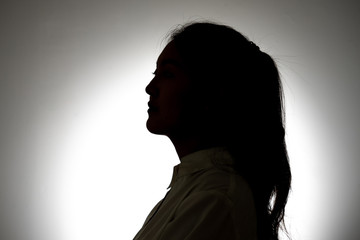 woman Anxious and sad appearance in dark silhouette