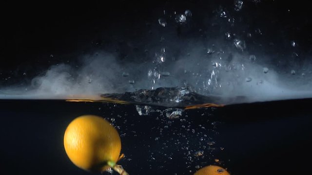 Video of falling granadilla in the water with smoke