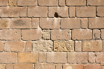 Background form a historic wall made of brown sandstone