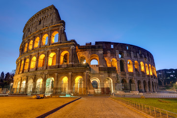 Fototapeta na wymiar The famous Colosseum in Rome illuminated at twilight
