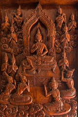 Samut Prakan, Thailand - February,23, 2020 : The image of Buddha's life is carved on the door of entrance the Buddhist temple Asokaram, Thailand.