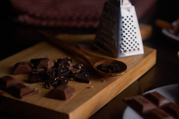 Chocolate chip pieces with chocolate pieces on cutting board