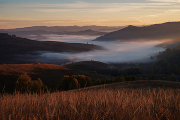 Morning fog in a mountain valley, sunrise. Autumn Altai.