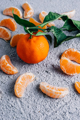 fresh tangerine pieces, healthy concept. Copy space. Wooden blue background