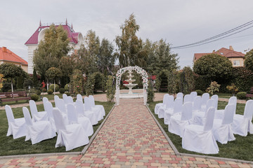 arch for a wedding ceremony with white flowers