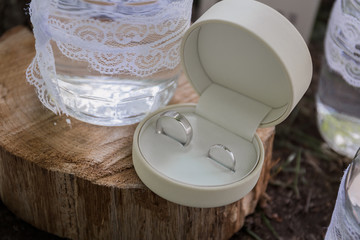 gold wedding rings in a round box