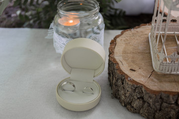 gold wedding rings in a round box