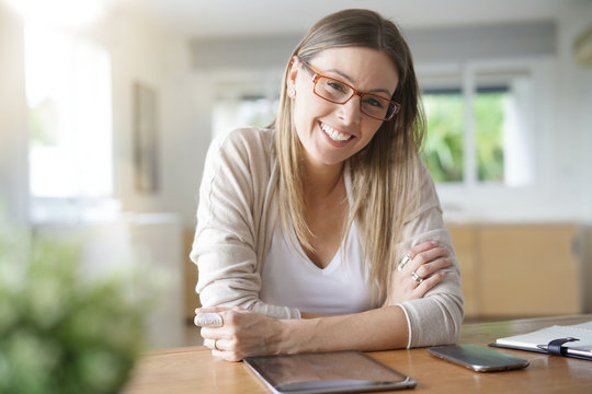 Cheerful woman working from home