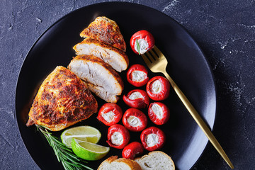 Chicken breast with marinated peppers, top view