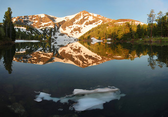 Lake in the Altai mountains at dawn, wonderful sunrise, beautiful reflection