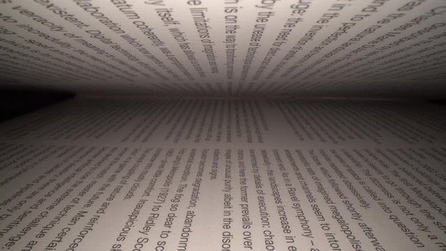 Dolly shot of camera sliding inside the book between letters. Latin letters and words on an open book with black dramatic background. Education, knowledge concept