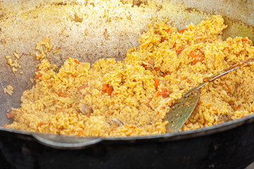 pilaf in a large cast-iron utensil