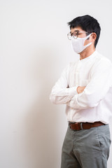 Asian businessman wearing surgical mask to prevent flu disease Coronavirus