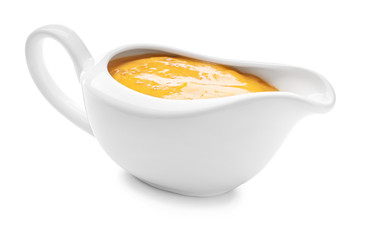 Gravy boat of tasty honey mustard sauce on white background