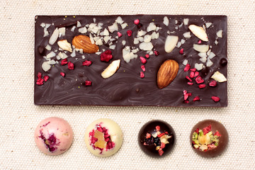 Handmade dark chocolate bar with a variety of dried fruit and nut toppings