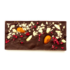 Handmade dark chocolate bar with a variety of dried fruit and nut toppings