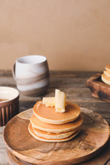Tasty pancakes with butter on plate
