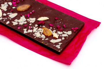 Handmade dark chocolate bar with a variety of dried fruit and nut toppings