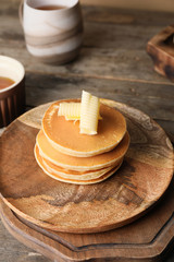 Tasty pancakes with butter on plate