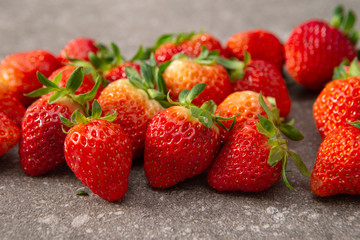 Fresh strawberry on stone background 