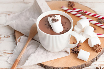 Cup of hot chocolate on white wooden table
