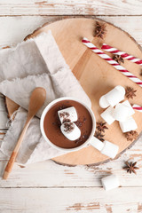 Cup of hot chocolate on white wooden table
