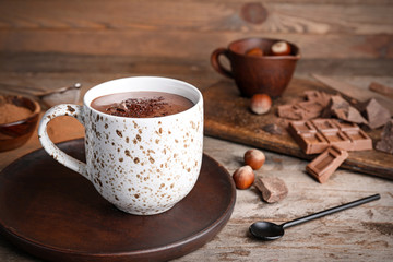 Cup of hot chocolate on wooden table