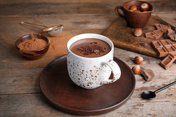 Cup of hot chocolate on wooden table