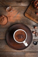 Cup of hot chocolate on wooden table