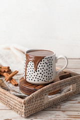 Fototapeta na wymiar Cup of hot chocolate on tray