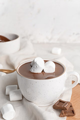 Cup of hot chocolate on table