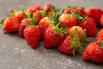 Fresh strawberry on stone background 