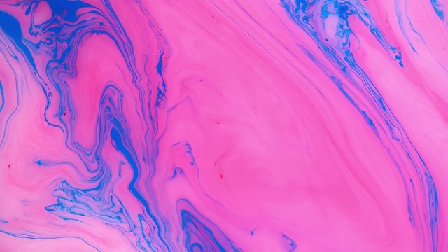 Abstract paint ink in motion. Psychedelic background footage. Flowing colorful spots. Liquid design.