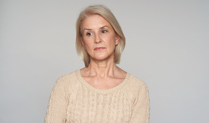Sad beautiful older woman. Isolated