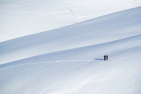The local village scanners/trackers trying to locate Snow Leopard in the vast snow covered mountains at Kibber, Spiti valley of Himachal Pradesh, India - Powered by Adobe
